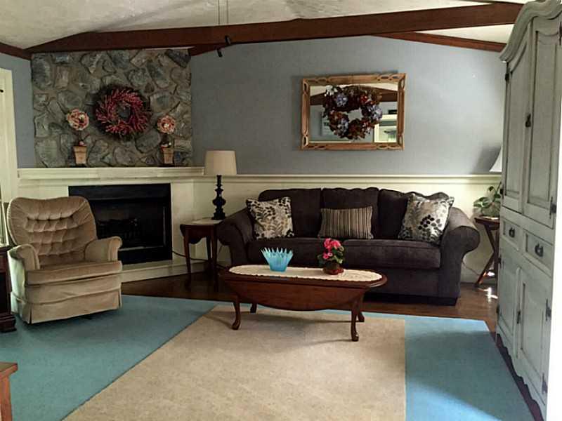 Family Room. 16x16 Family room  w/plenty of natural light, high ceilings, electric fireplace, HW & french doors to outside decks!