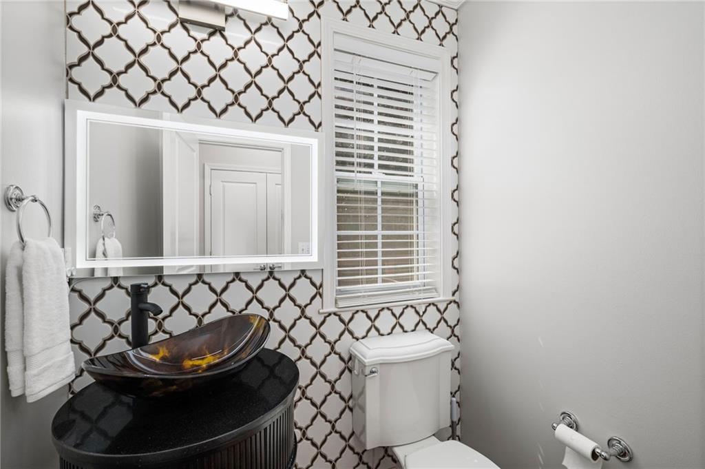 2872 Overlook Way Northeast Atlanta, GA 30324 - Photo 14 of 47 a bathroom with a sink and a toilet