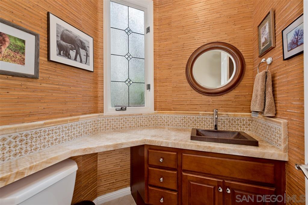 3138 Hamburg Square La Jolla, CA 92037 - Photo 13 of 25 a bathroom with a sink a mirror and a shower