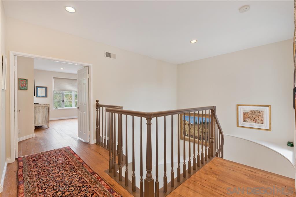 3138 Hamburg Square La Jolla, CA 92037 - Photo 15 of 25 a view of a hallway with wooden floor and a bathroom
