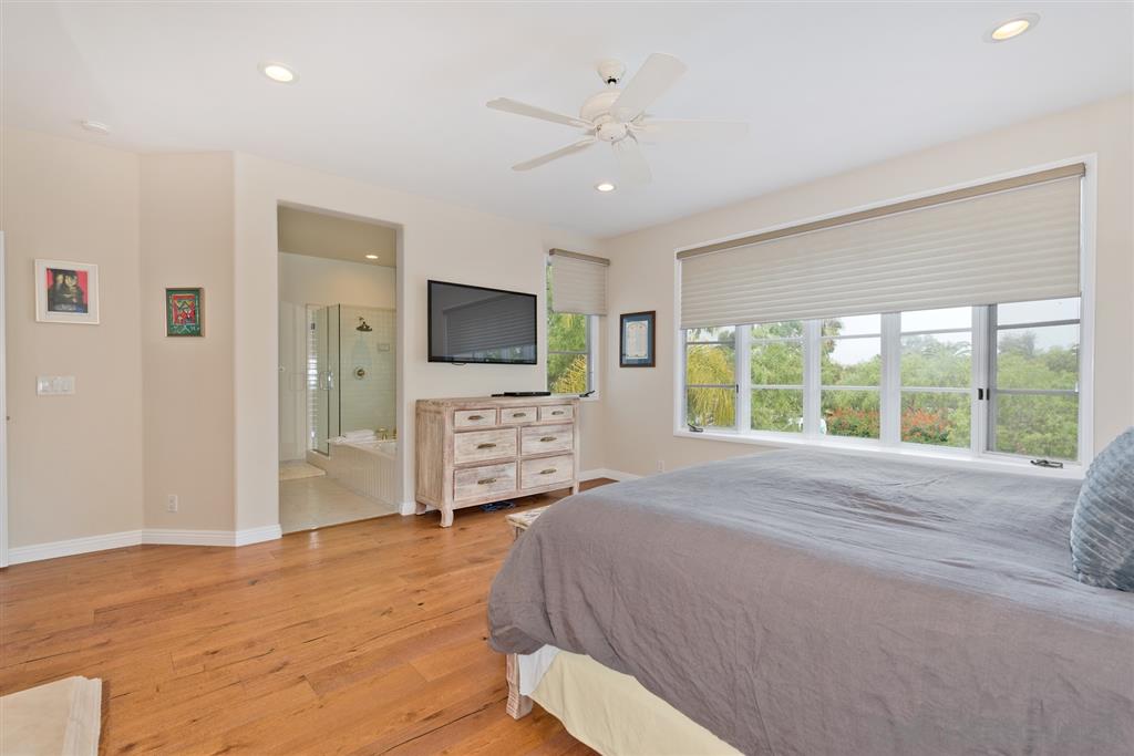 3138 Hamburg Square La Jolla, CA 92037 - Photo 16 of 25 a spacious bedroom with a bed window and a television