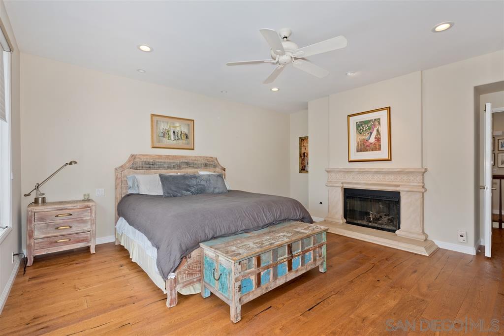 3138 Hamburg Square La Jolla, CA 92037 - Photo 17 of 25 a bedroom with a bed and a fireplace