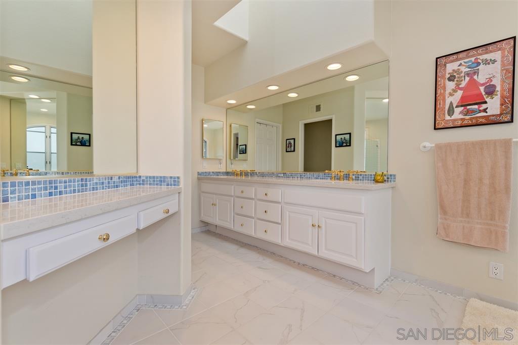 3138 Hamburg Square La Jolla, CA 92037 - Photo 19 of 25 a spacious bathroom with a granite countertop sink mirror and