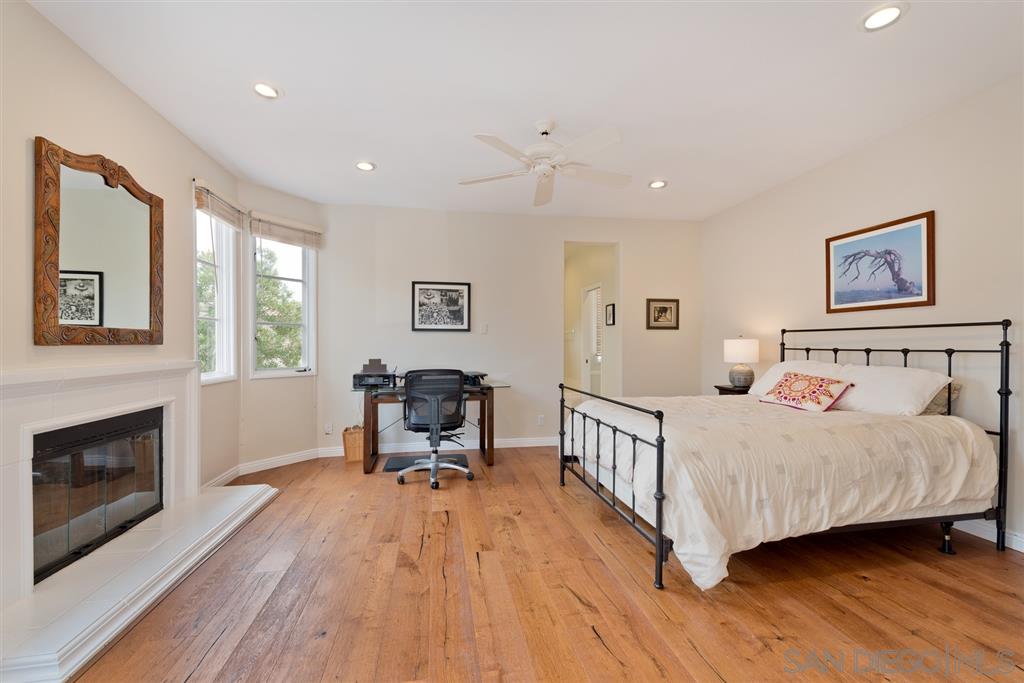 3138 Hamburg Square La Jolla, CA 92037 - Photo 20 of 25 a bedroom with a bed and a table in it