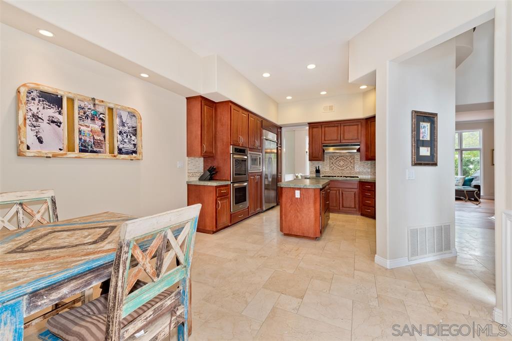 3138 Hamburg Square La Jolla, CA 92037 - Photo 3 of 25 a kitchen with stainless steel appliances granite countertop a refrigerator and a sink