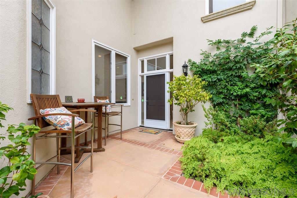 3138 Hamburg Square La Jolla, CA 92037 - Photo 5 of 25 a backyard of a house with table and chairs