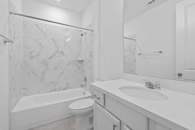 a bathroom with a sink a toilet and a bathtub