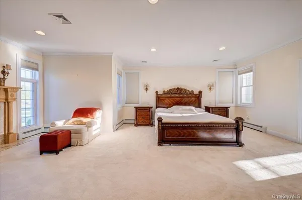 a bedroom with bed and window