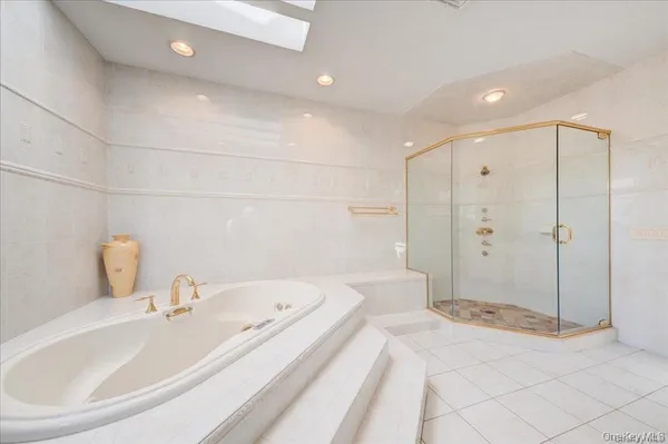 a bathroom with a bathtub and a sink