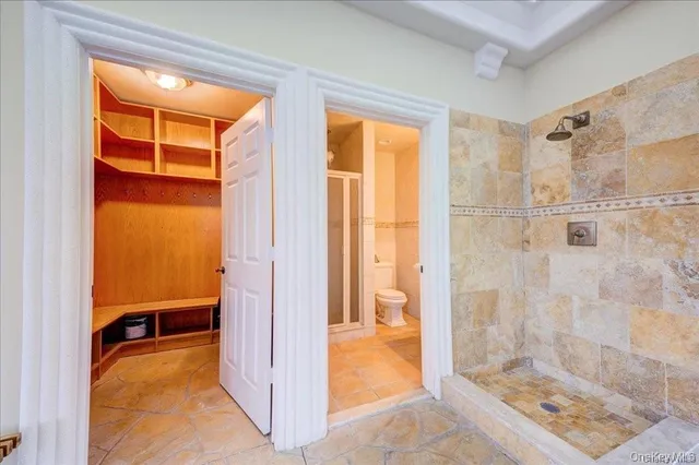 a bathroom with a tub and shower