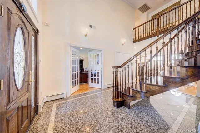 a view of entryway with wooden floor and a rug