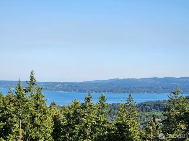 an aerial view of a house with mountain view