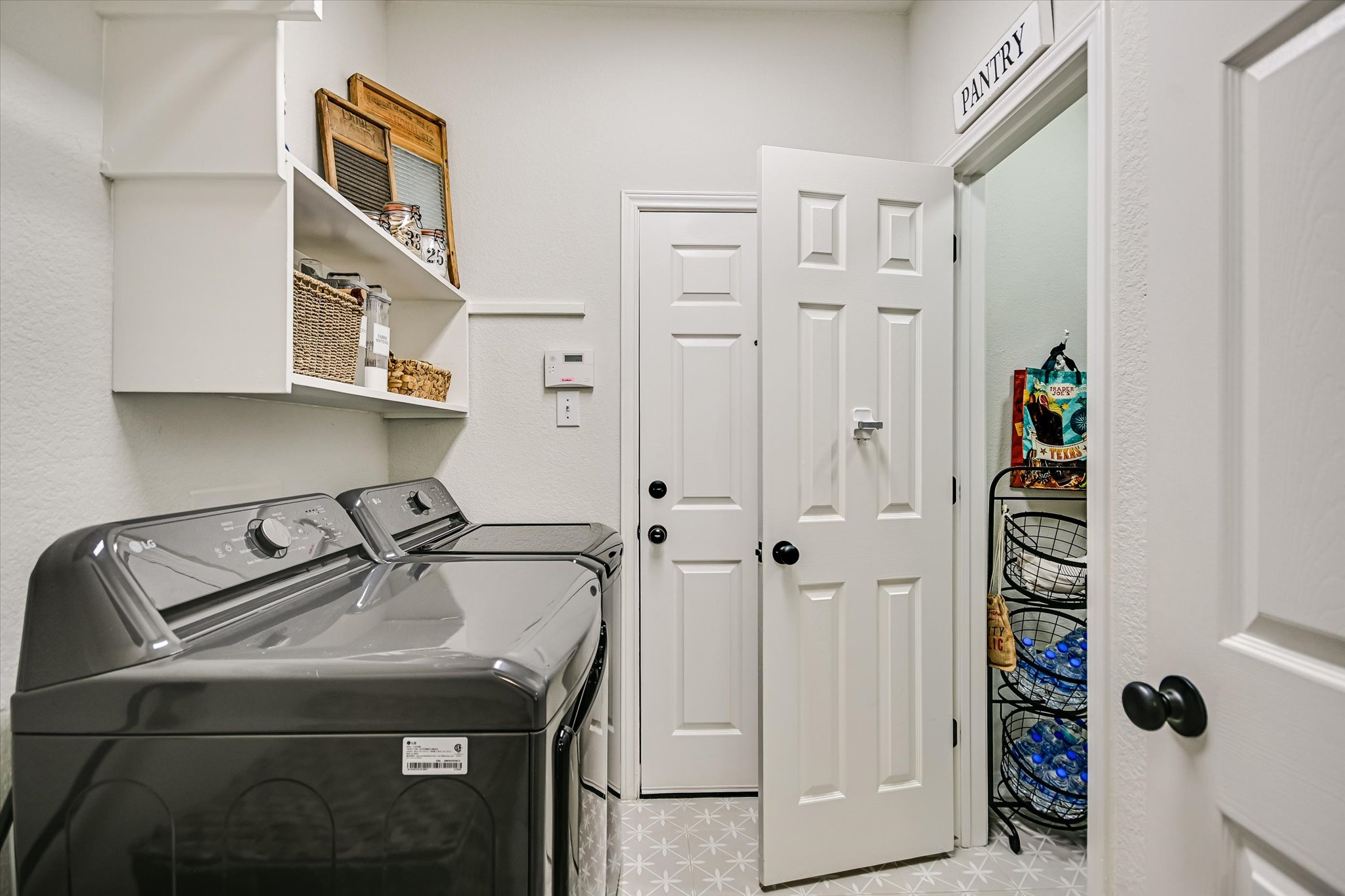 2900 Grimes Ranch Road Austin, TX 78732 - Photo 19 of 38 The laundry area offers everyday convenience with a recently purchased washer and dryer that will convey.