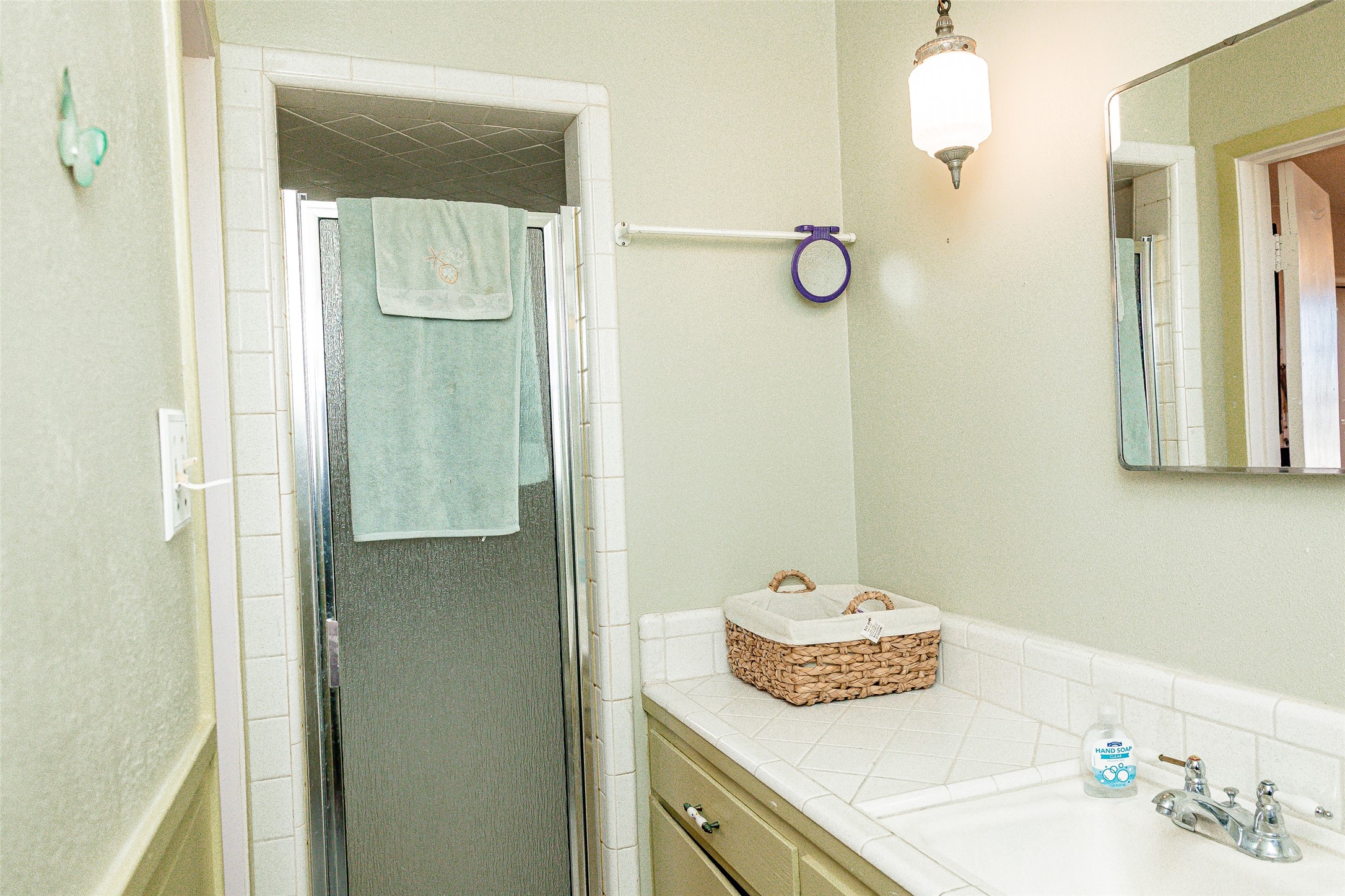 8608 Captain Scott Road Brenham, TX 77833 - Photo 11 of 28 a bathroom with a sink and mirror