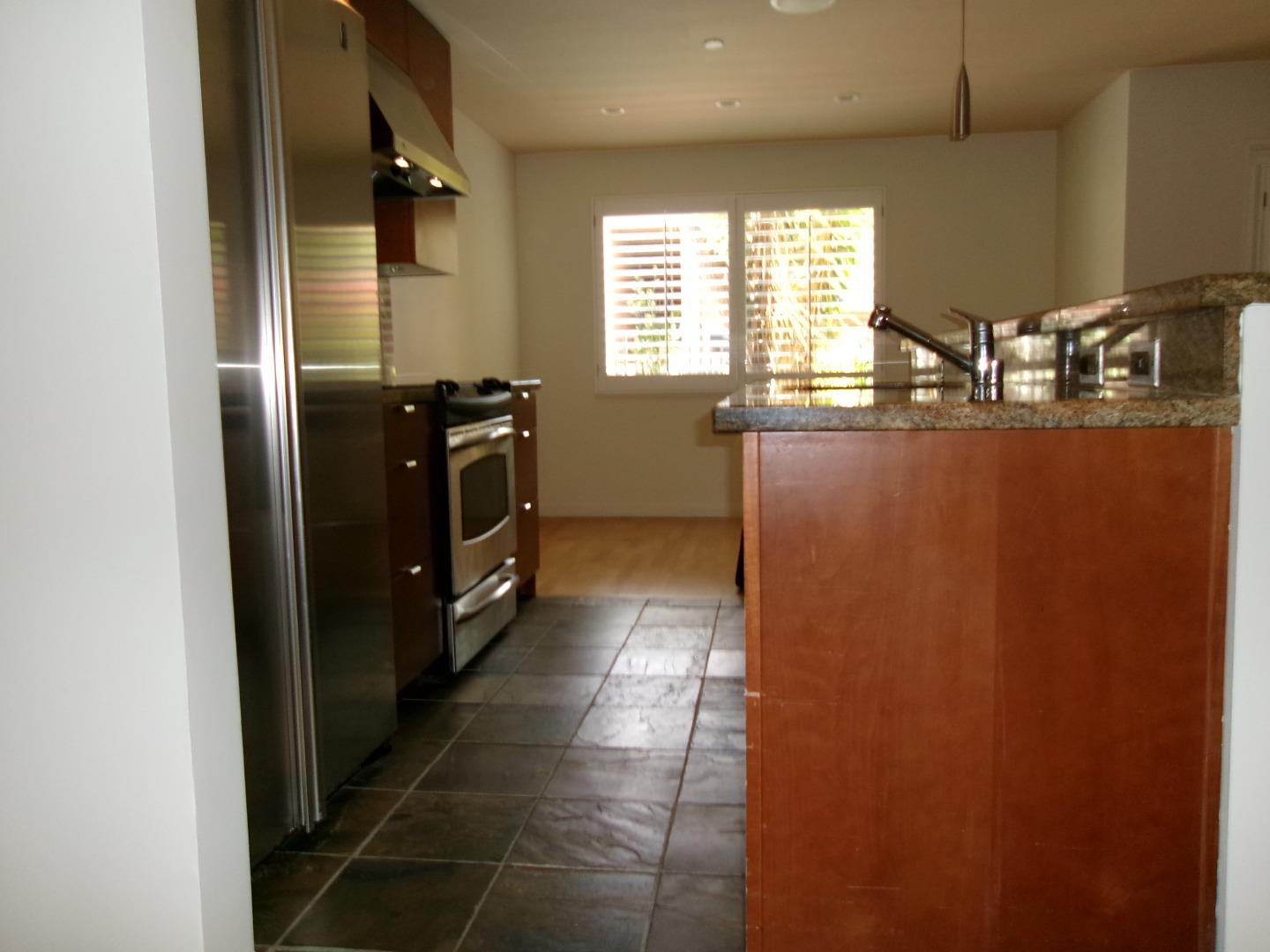 1855 Palm View Place, Unit 123 Santa Clara, CA 95050 - Photo 12 of 18 a kitchen with granite countertop a refrigerator and window
