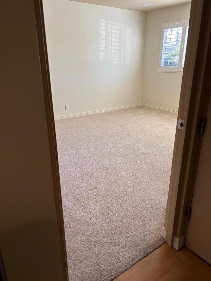 1855 Palm View Place, Unit 123 Santa Clara, CA 95050 - Photo 13 of 18 an empty room with windows