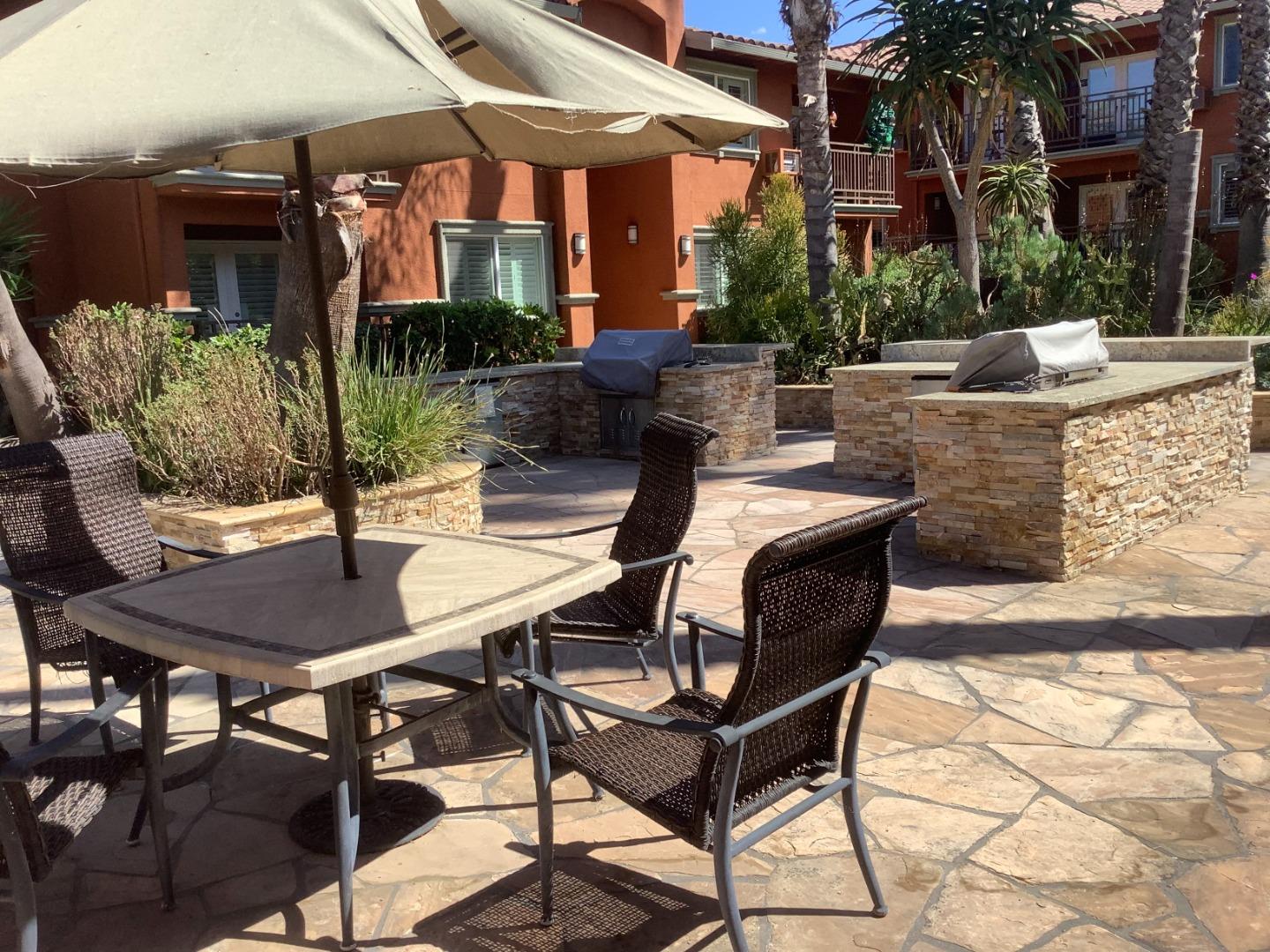 1855 Palm View Place, Unit 123 Santa Clara, CA 95050 - Photo 4 of 18 a view of a patio with a table and chairs