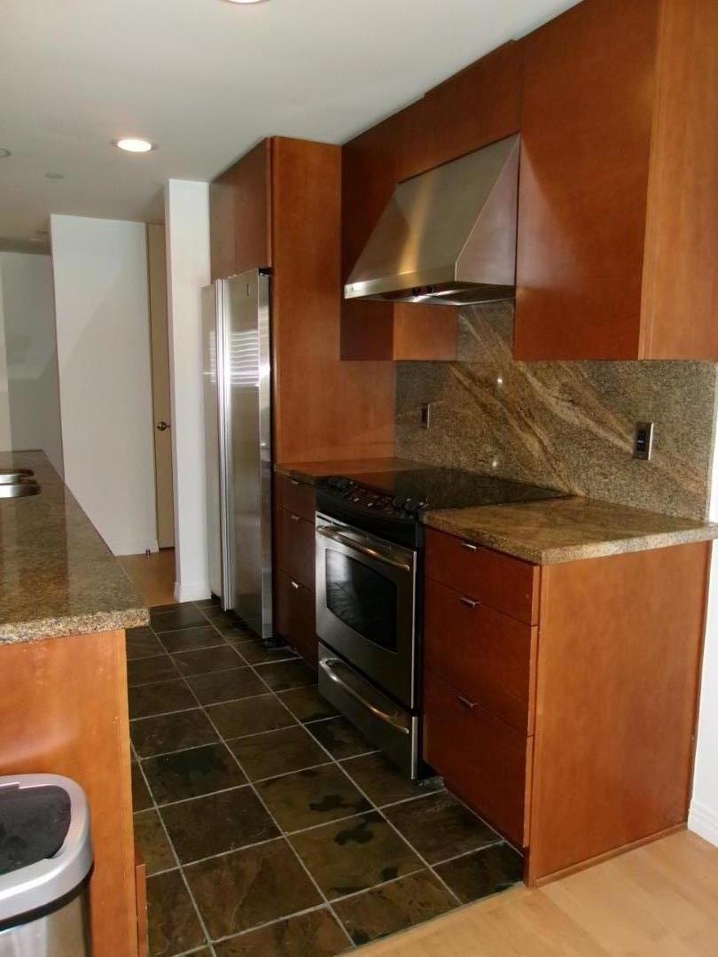 1855 Palm View Place, Unit 123 Santa Clara, CA 95050 - Photo 9 of 18 a kitchen with a sink a refrigerator and cabinets