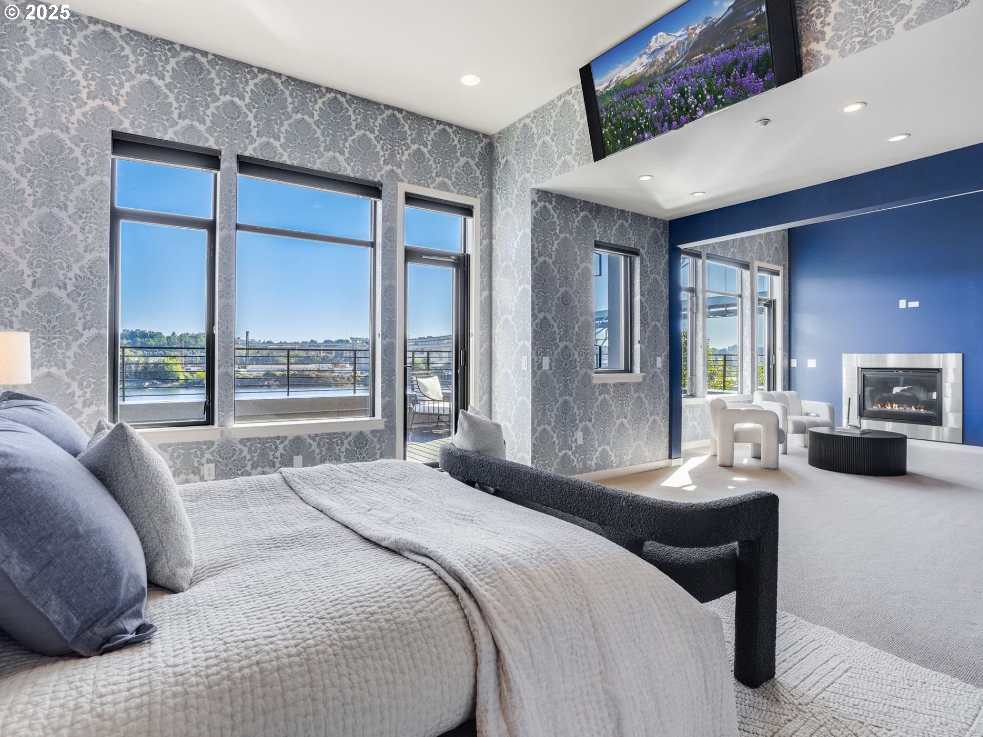 1714 Northwest Riverscape Street Portland, OR 97209 - Photo 11 of 19 a bedroom with a large bed and a balcony