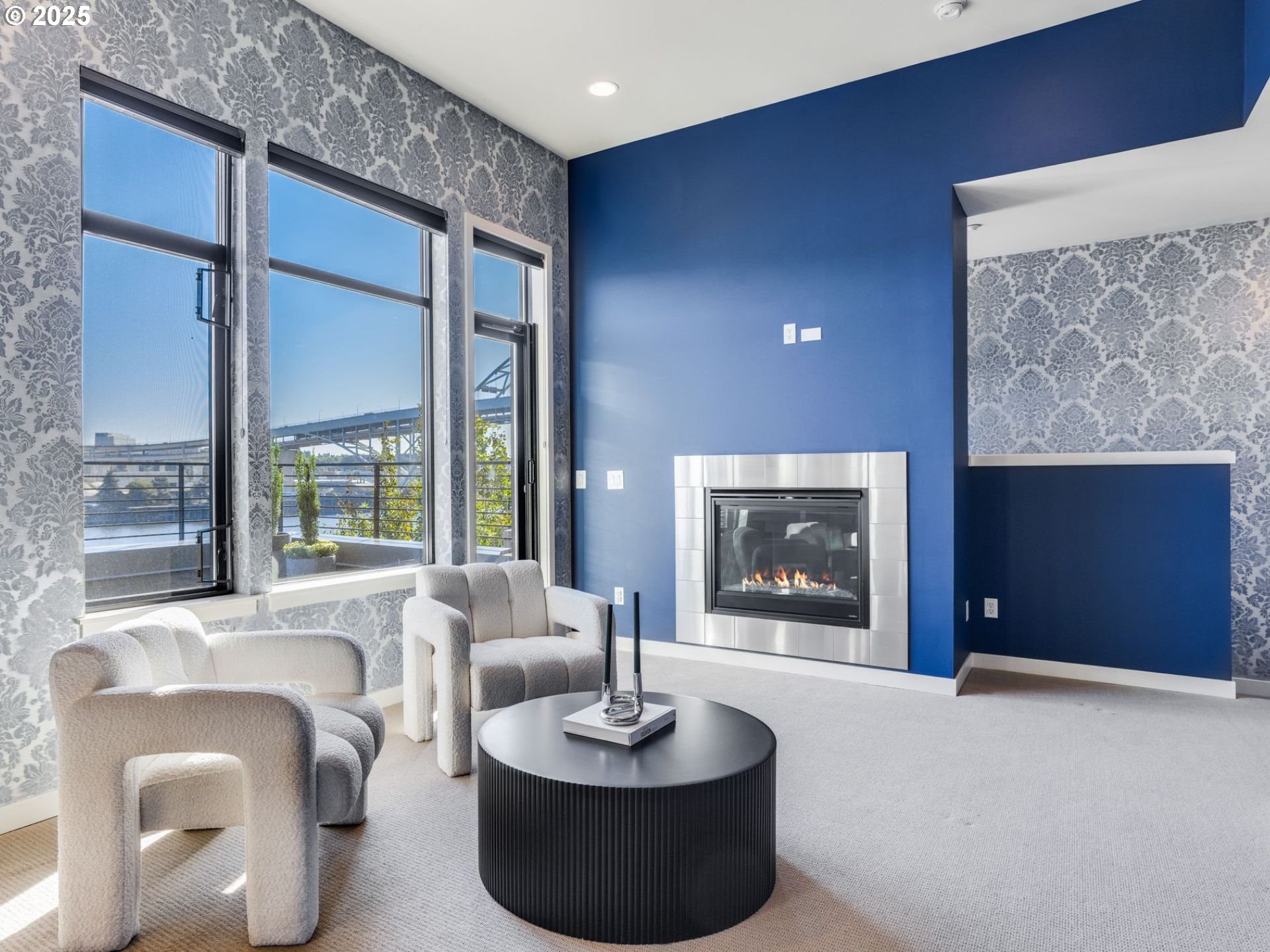 1714 Northwest Riverscape Street Portland, OR 97209 - Photo 12 of 19 a living room with furniture and a painting