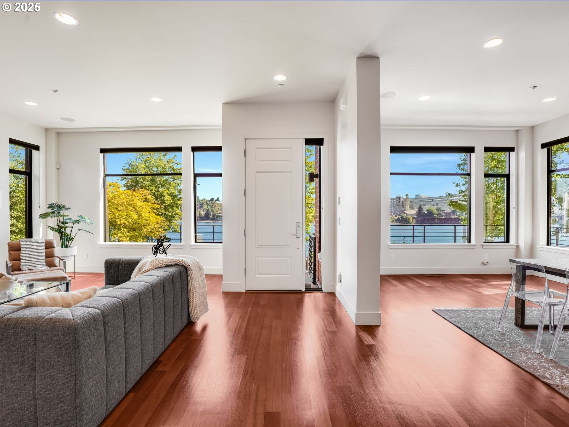 1714 Northwest Riverscape Street Portland, OR 97209 - Photo 3 of 19 a living room with furniture and large windows