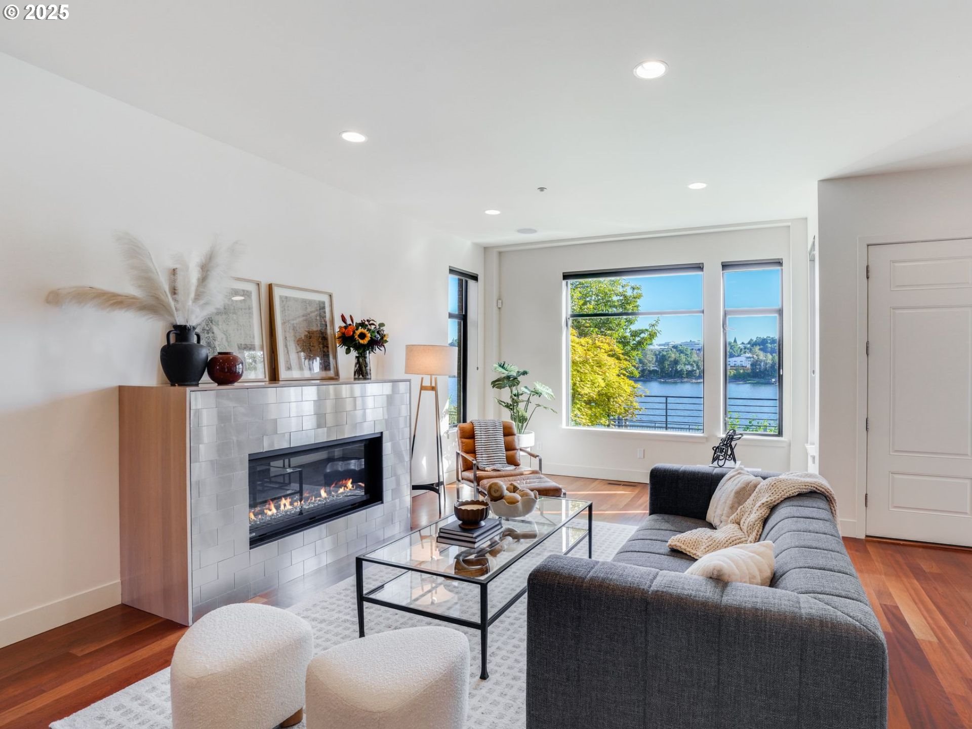 1714 Northwest Riverscape Street Portland, OR 97209 - Photo 4 of 19 a living room with furniture a large window and a fireplace