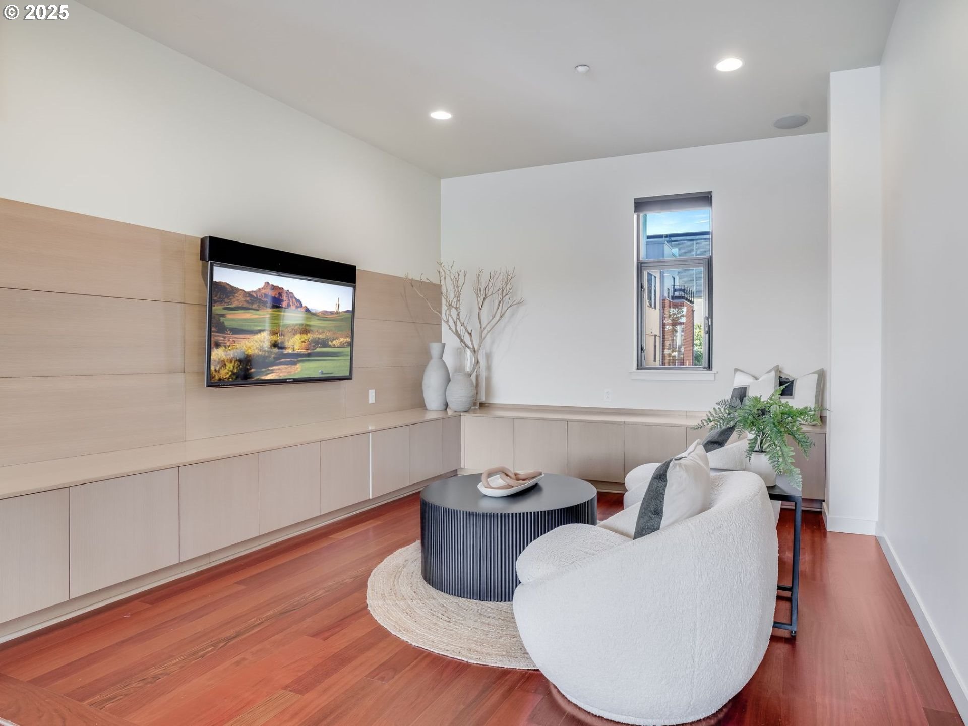 1714 Northwest Riverscape Street Portland, OR 97209 - Photo 8 of 19 a living room with furniture a window and a flat screen tv