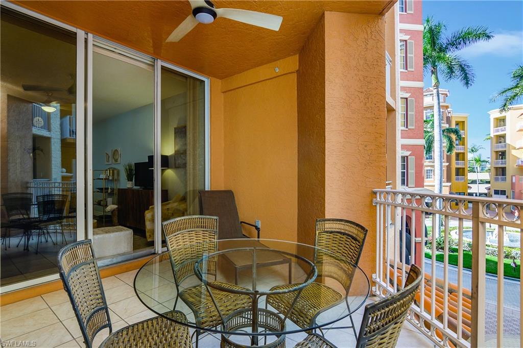 451 Bayfront Place, Unit 5201 Naples, FL 34102 - Photo 3 of 38 a balcony with table and chairs