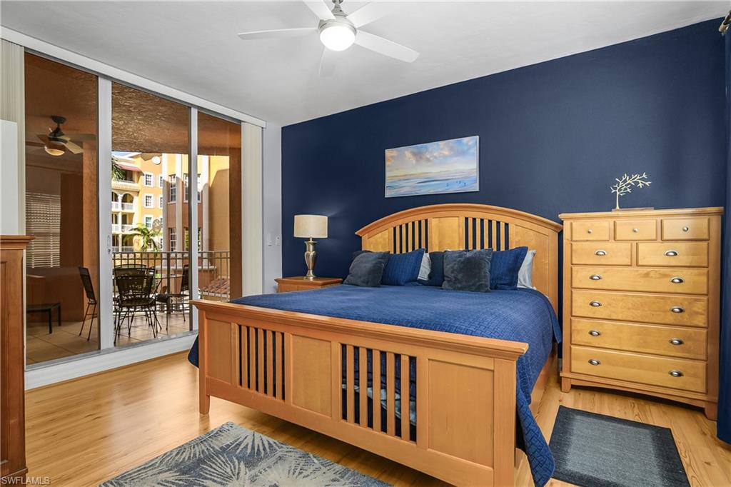 451 Bayfront Place, Unit 5201 Naples, FL 34102 - Photo 6 of 38 a view of a bedroom with furniture and staircase