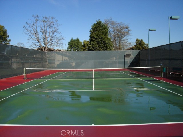 8855 Sutter Circle, Unit 515B Huntington Beach, CA 92646 - Photo 60 of 61 Tennis Court since refinished in blue and green colors.