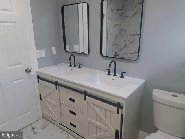 a bathroom with a sink and a toilet