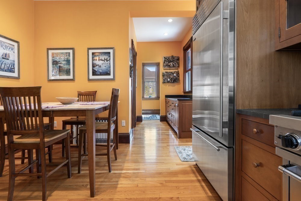 191 Cottage Park Road Winthrop, MA 02152 - Photo 17 of 41 a kitchen with stainless steel appliances dining table and chairs