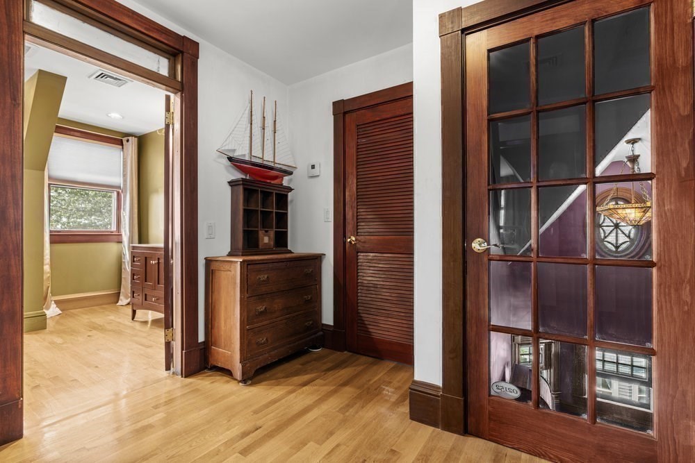 191 Cottage Park Road Winthrop, MA 02152 - Photo 21 of 41 a view of hallway with cabinets and wooden floor