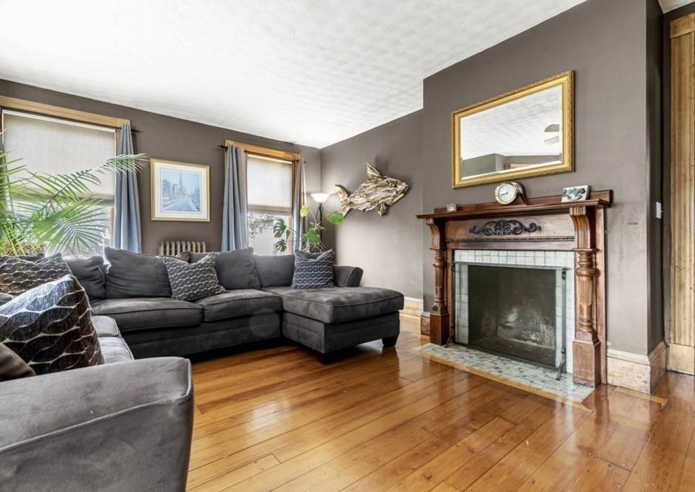 191 Cottage Park Road Winthrop, MA 02152 - Photo 25 of 41 a living room with furniture and a fireplace