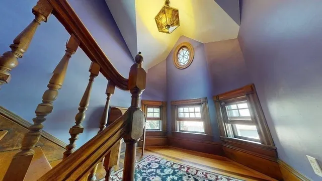 a bed room with a bed and a chair