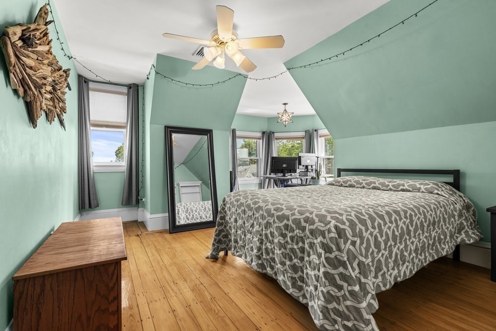 191 Cottage Park Road Winthrop, MA 02152 - Photo 28 of 41 a bedroom with a bed mirror and a window