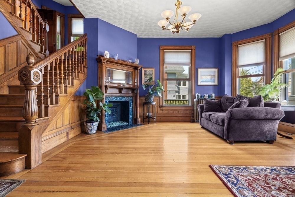 191 Cottage Park Road Winthrop, MA 02152 - Photo 4 of 41 a living room with furniture a fireplace and a chandelier