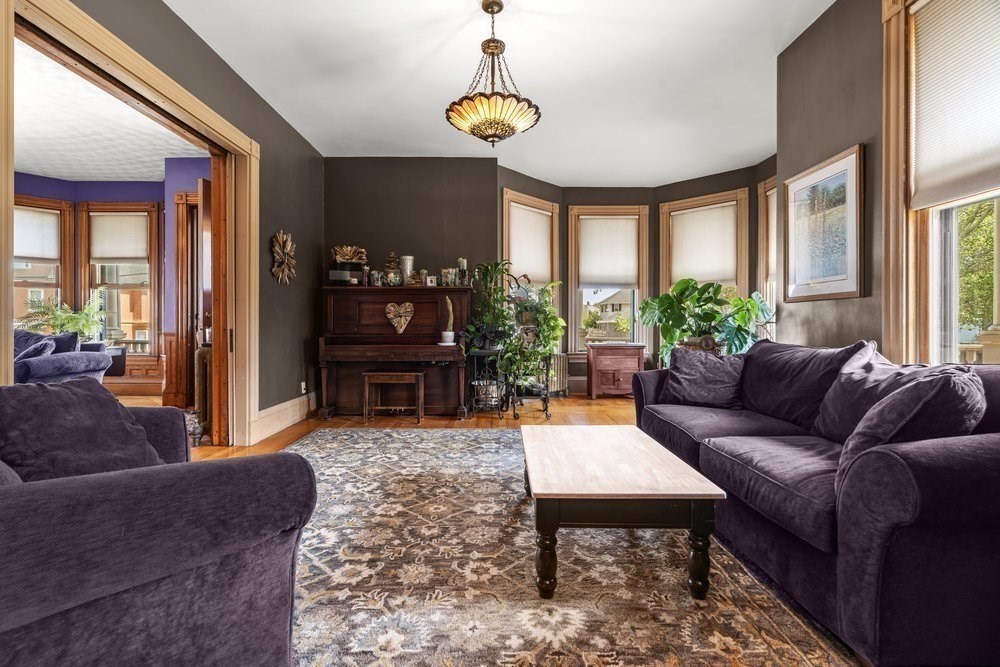 191 Cottage Park Road Winthrop, MA 02152 - Photo 7 of 41 a living room with furniture a chandelier and a window