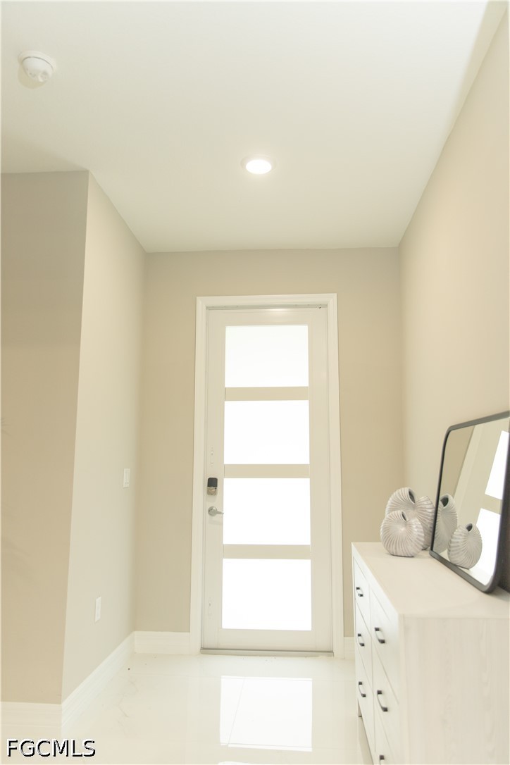 1228 Chrisholm Street Lehigh Acres, FL 33974 - Photo 17 of 18 a bathroom with a sink and a window