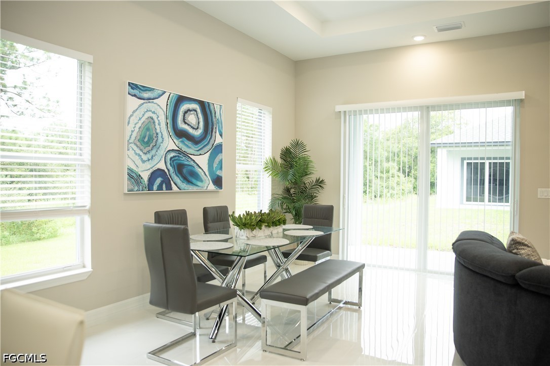 1228 Chrisholm Street Lehigh Acres, FL 33974 - Photo 3 of 18 a work room with furniture and a window