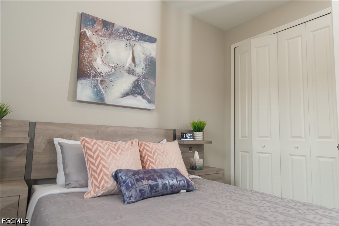 1228 Chrisholm Street Lehigh Acres, FL 33974 - Photo 8 of 18 a living room with furniture and a lamp