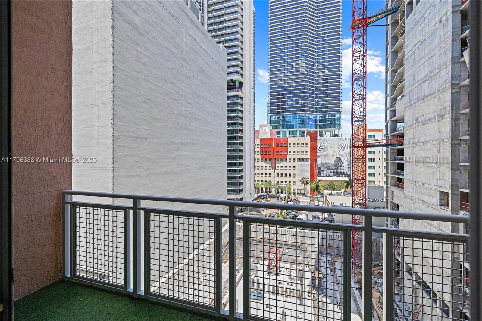 244 Biscayne Boulevard, Unit 645 Miami, FL 33132 - Photo 11 of 45 a view of a balcony with a wooden fence