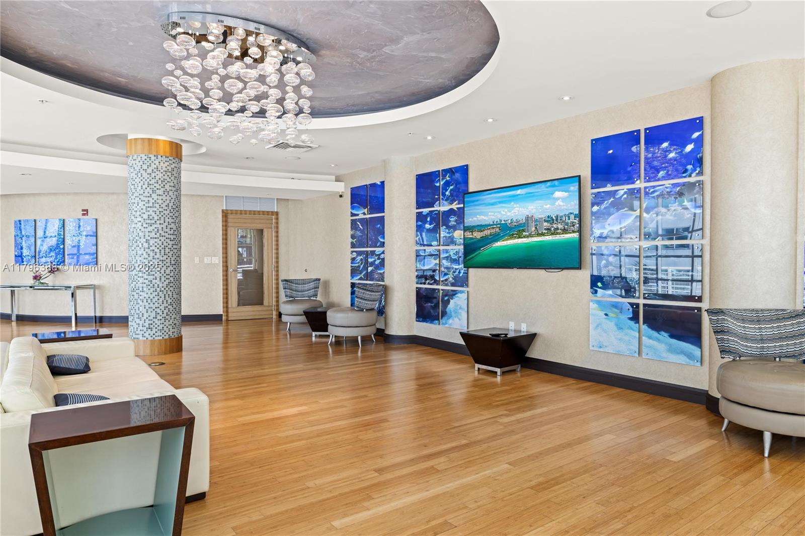 244 Biscayne Boulevard, Unit 645 Miami, FL 33132 - Photo 21 of 45 a living room with furniture and a chandelier