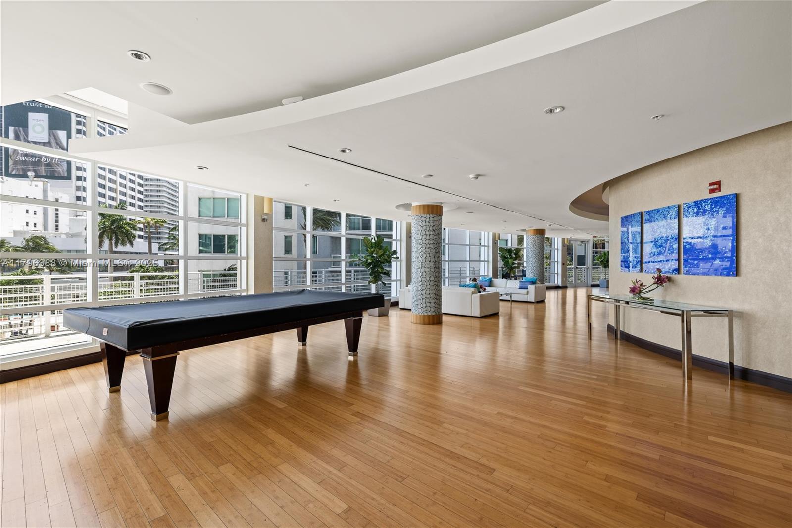 244 Biscayne Boulevard, Unit 645 Miami, FL 33132 - Photo 22 of 45 a view of a living room or kitchen with a table and chairs