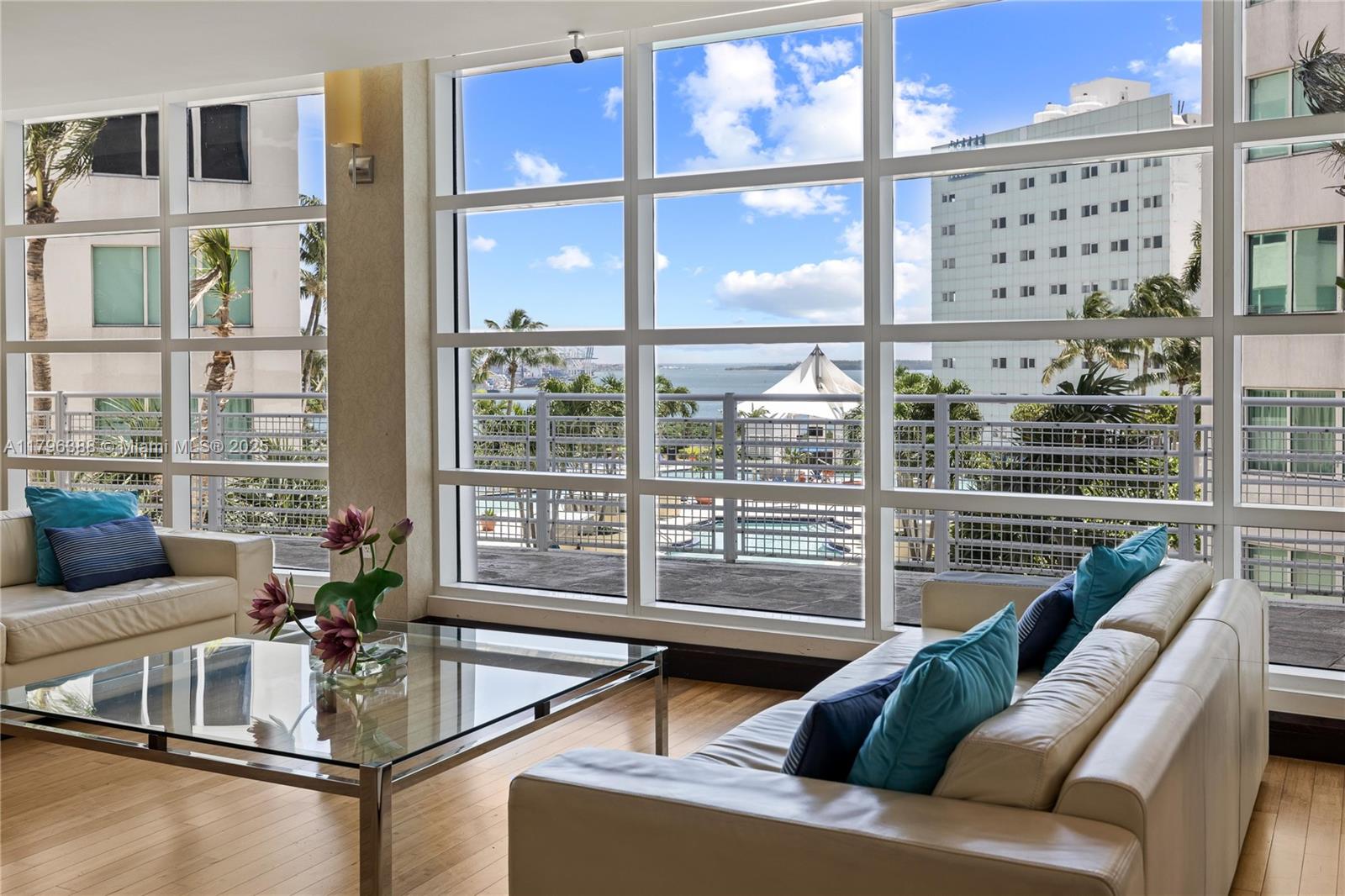 244 Biscayne Boulevard, Unit 645 Miami, FL 33132 - Photo 23 of 45 a living room with furniture and a large window