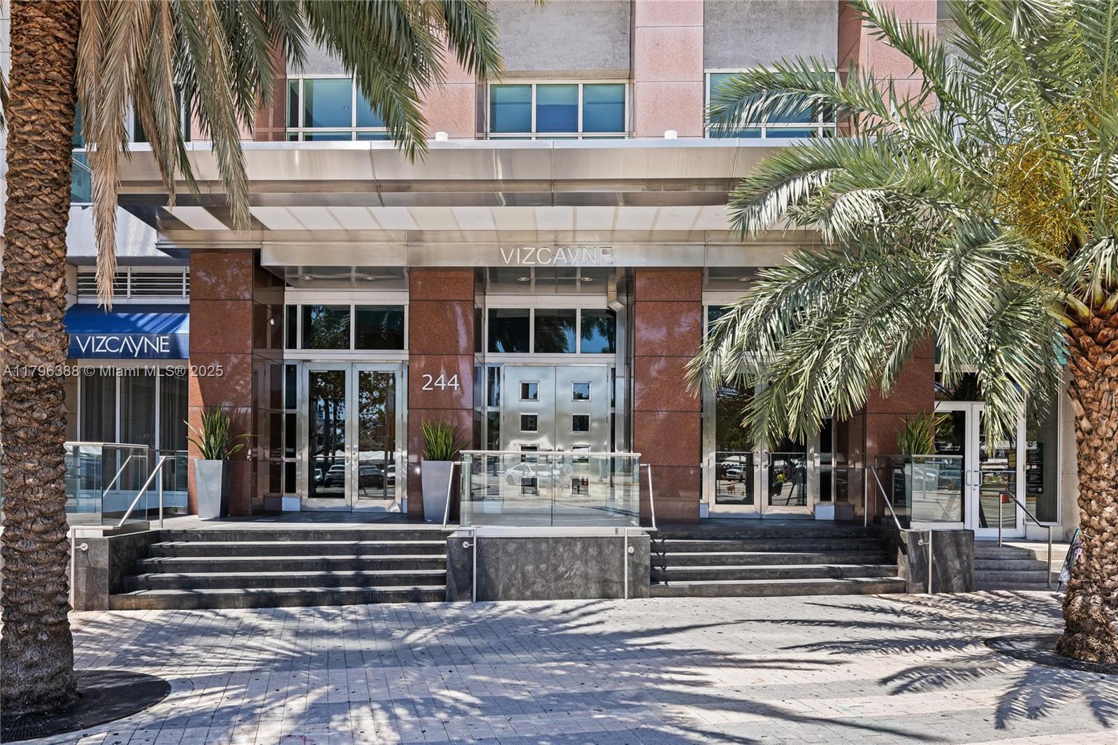 244 Biscayne Boulevard, Unit 645 Miami, FL 33132 - Photo 45 of 45 a front view of a building with a garden