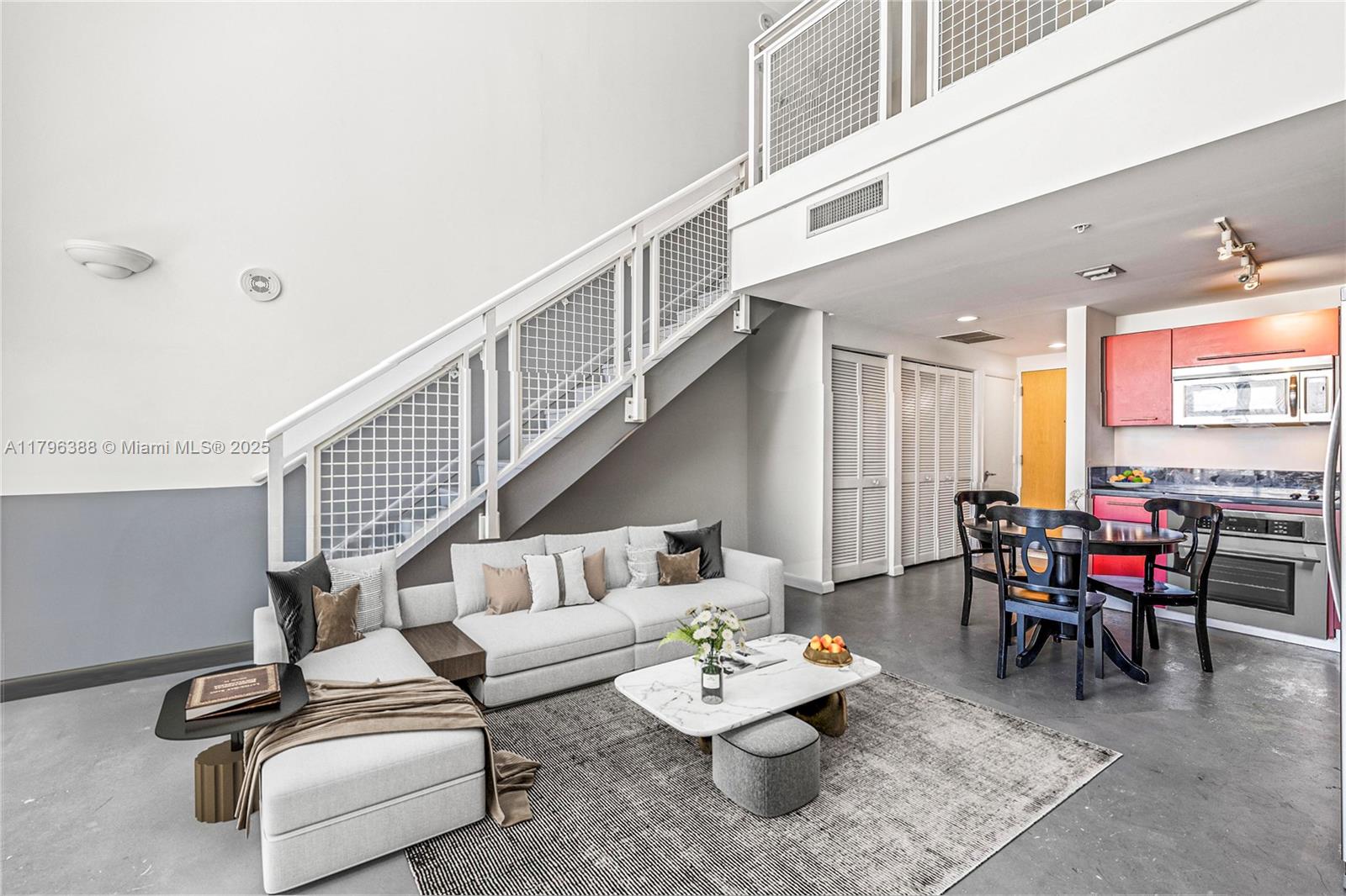 244 Biscayne Boulevard, Unit 645 Miami, FL 33132 - Photo 6 of 45 a living room with furniture and wooden floor