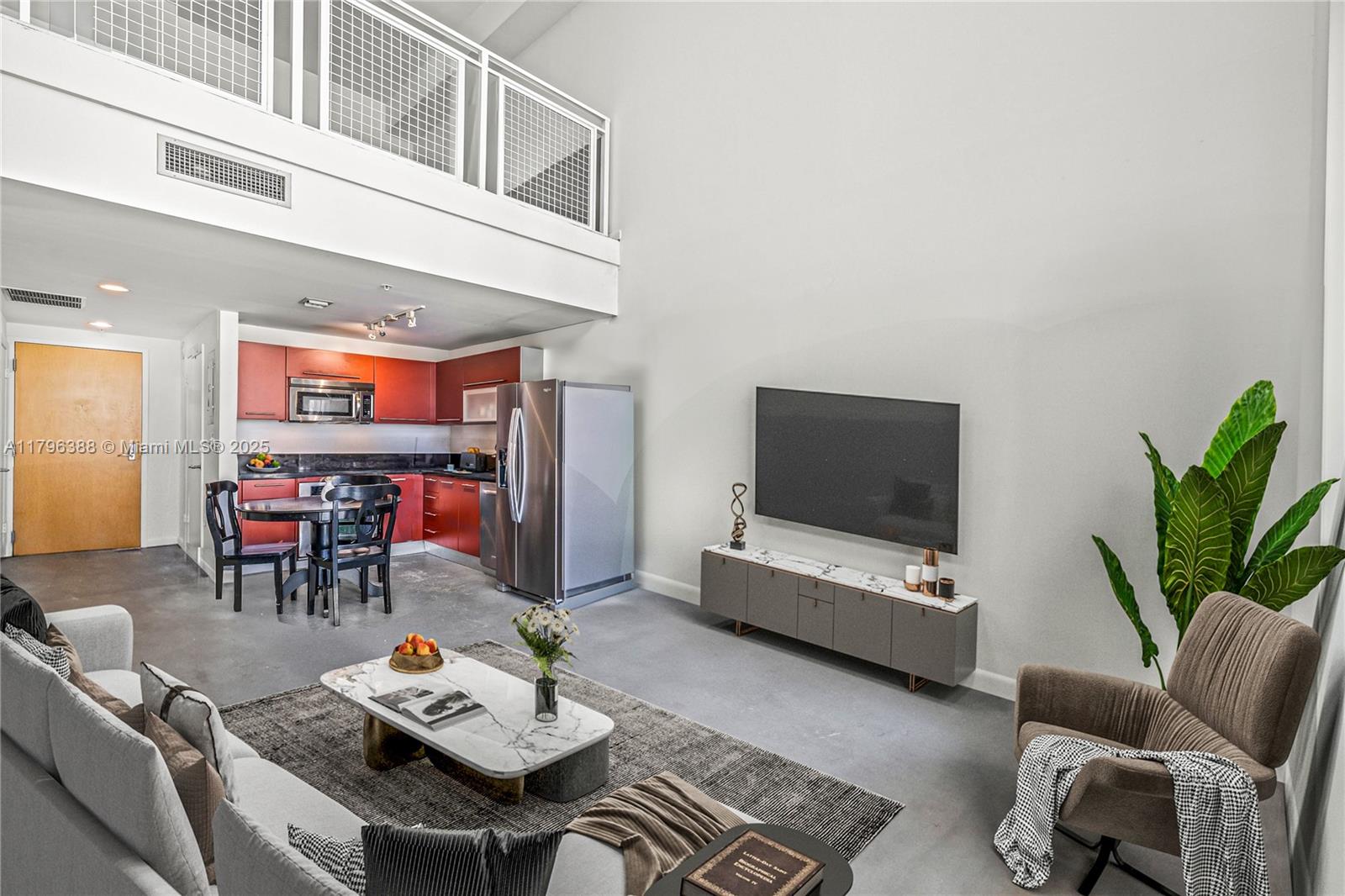 244 Biscayne Boulevard, Unit 645 Miami, FL 33132 - Photo 10 of 45 a living room with furniture and a flat screen tv