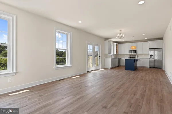 a kitchen with a sink cabinets and window