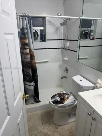 a bathroom with a toilet and a sink